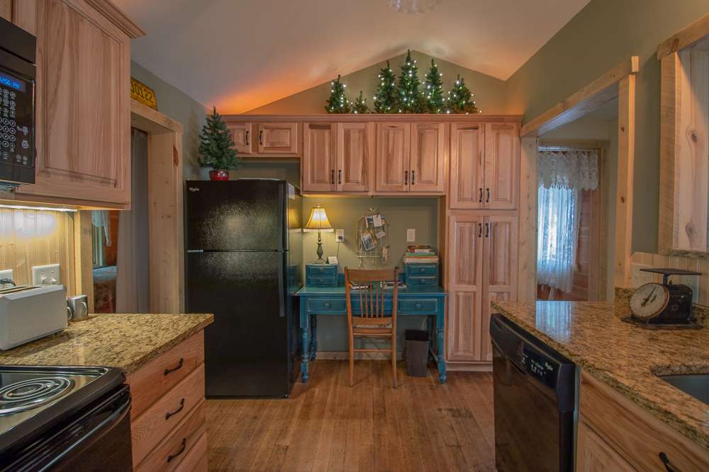 Redemption Cabin is an extraordinary vacation rental cabin near RMNP in Estes Park CO USA. This is an image of its kitchen.