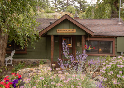 Storybook Exploration Cabin is an Extraordinary Mountain Town Vacation Home in Estes Park CO USA near Rocky Mountain National Park. This is an image of the front garden.