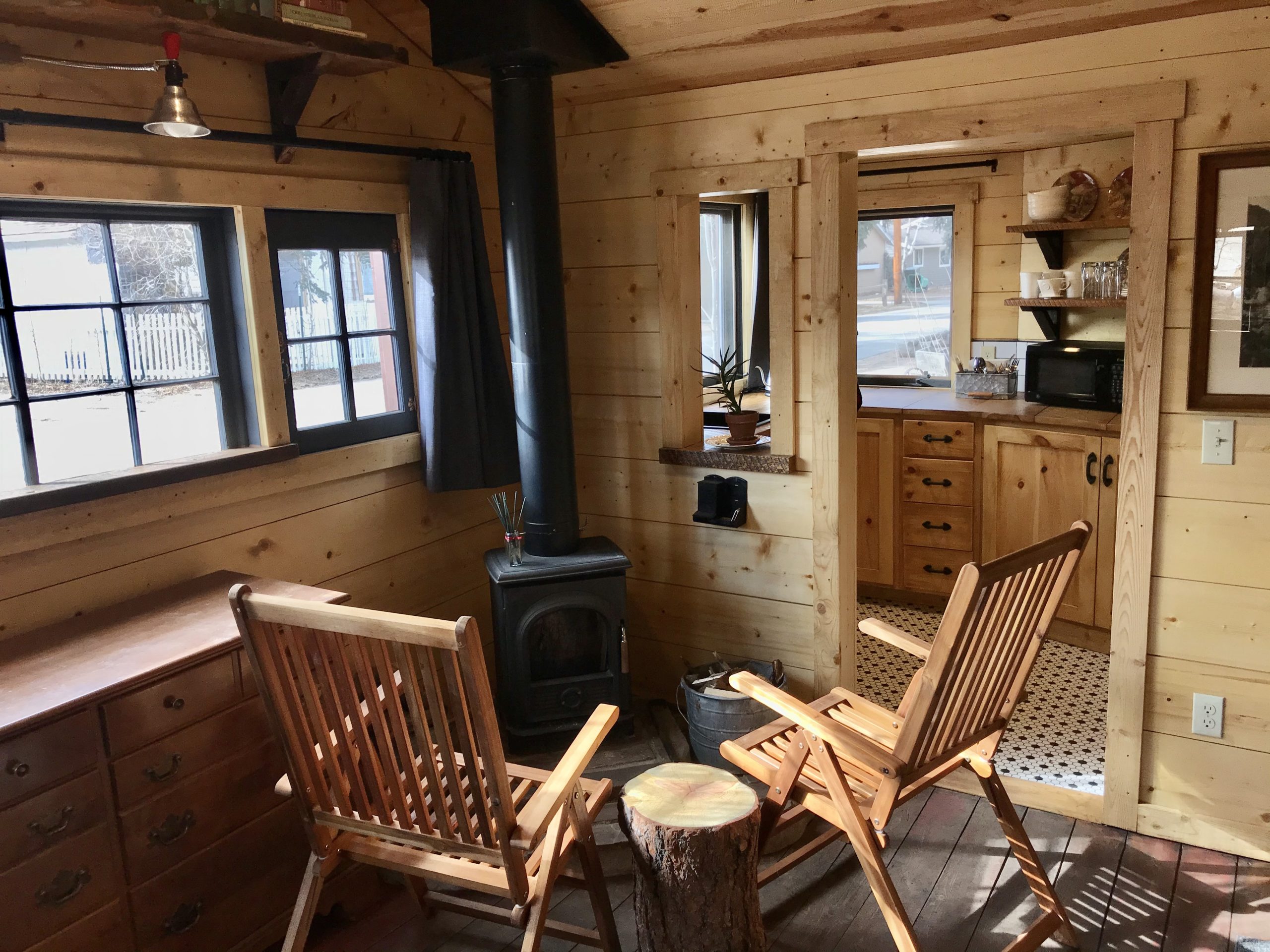 Reflection Cabin is an extraordinary vacation rental cabin near RMNP in Estes Park CO US. This is an image of its front room. with fireplace