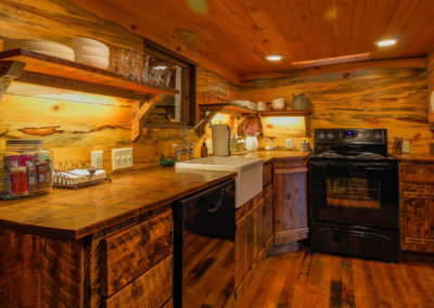 Exploration Cabin is an extraordinary Mountain Town vacation rental in Estes Park Co near Rocky Mountain National Park. This is an image of its kitchen.