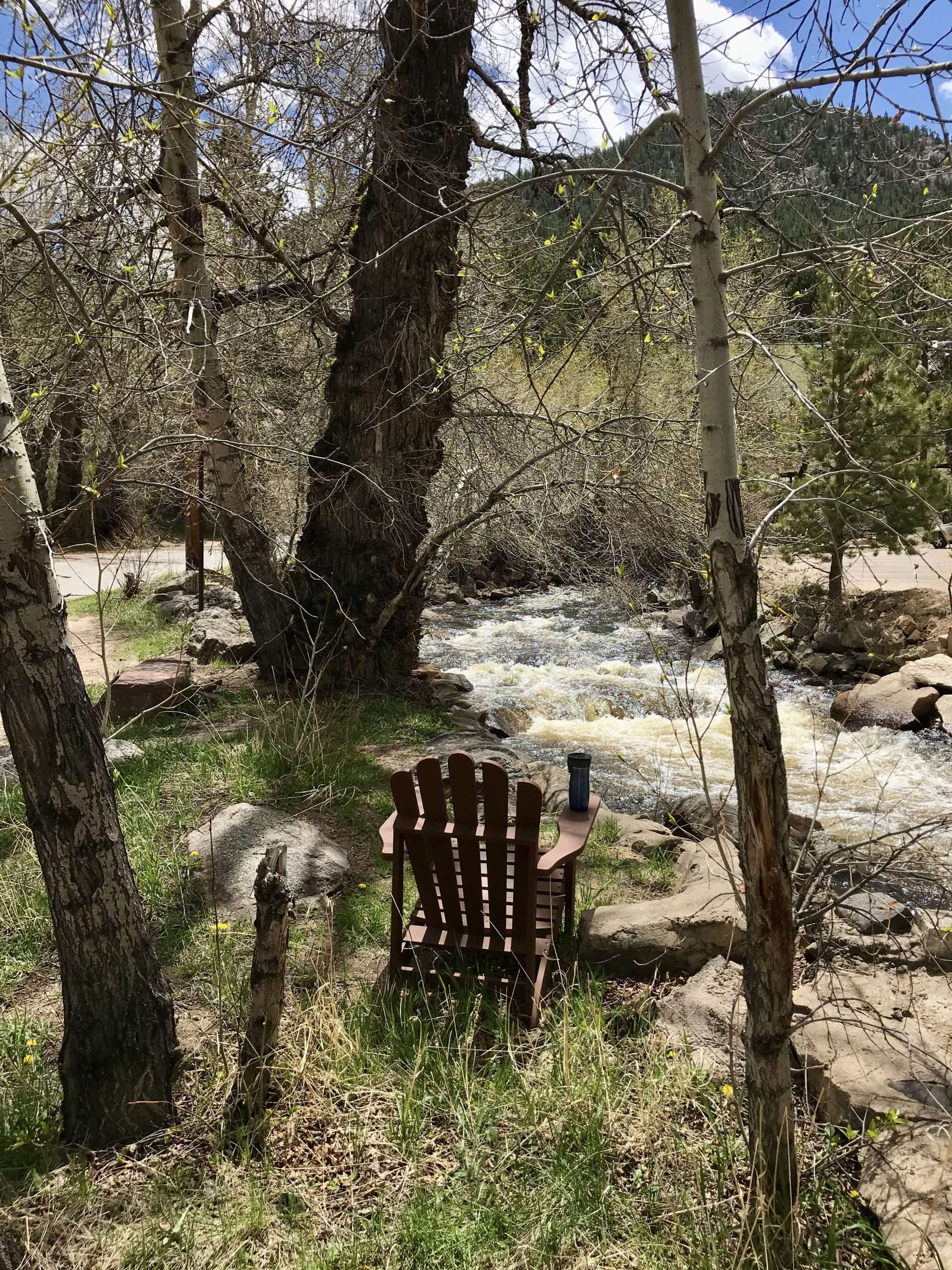 This is an image of This Mountain Life's quiet spot by the rushing Big Thompson River that flows out of Rocky Mountain National Park