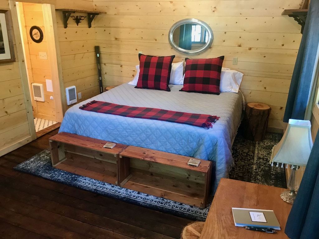 Reflection Cabin is an extraordinary vacation rental cabin near RMNP in Estes Park CO US. This is an image of its front room. with fireplace